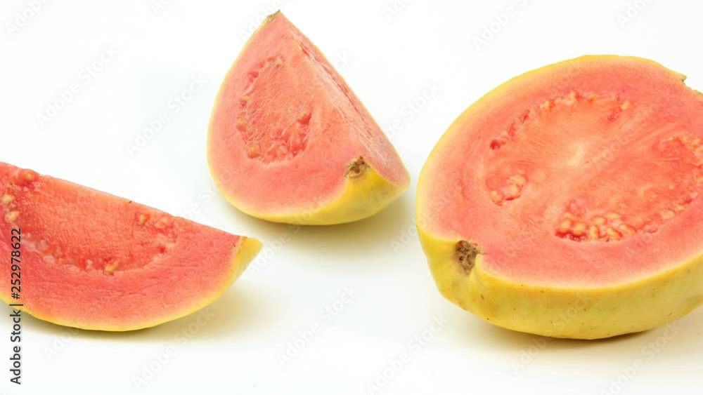 close-up guava fruit, pink, fresh, organic, with leaves, whole and sliced, isolated on white background