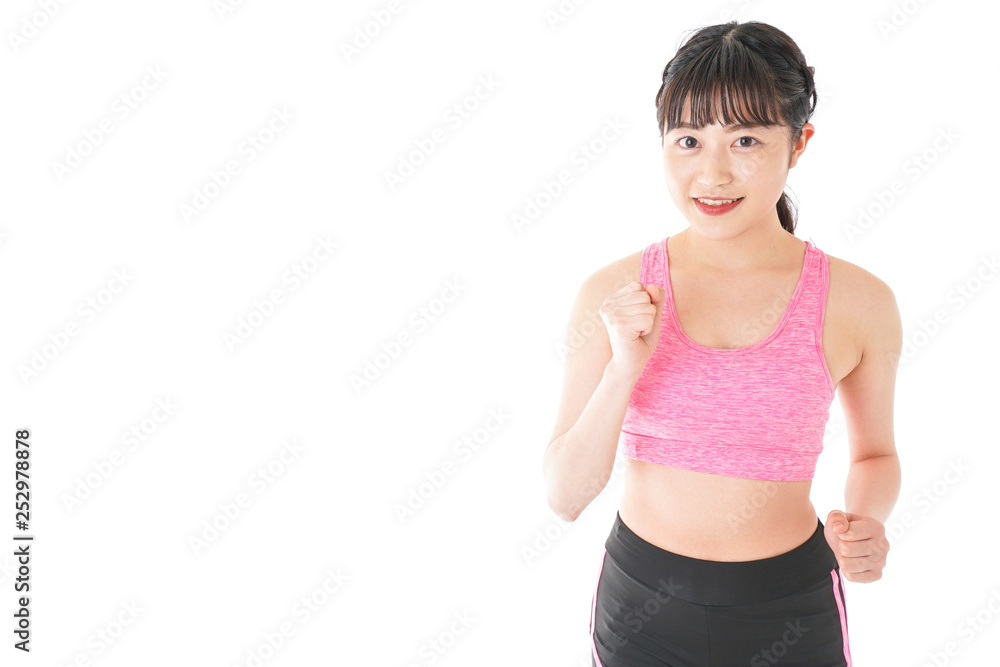 ランニングをする若い女性 ランニングをする若い女性