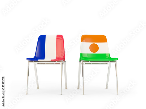 Two chairs with flags of France and niger