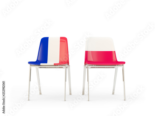 Two chairs with flags of France and poland