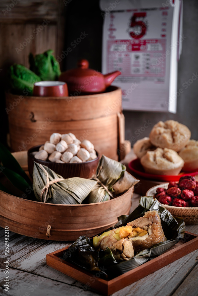 Chinese New Year party table with food and traditional decorations.