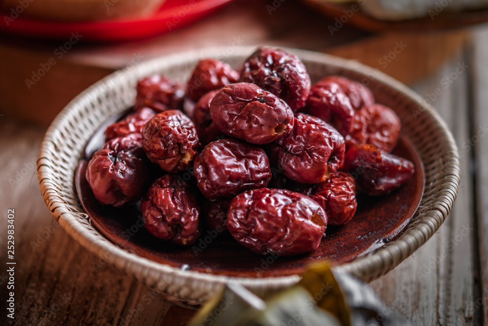 Dried red date or Chinese jujube. Traditional herbal medicine spill Dried red date or Chinese jujube. Traditional herbal medicine spill