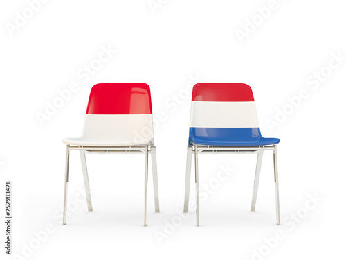 Two chairs with flags of Indonesia and netherlands