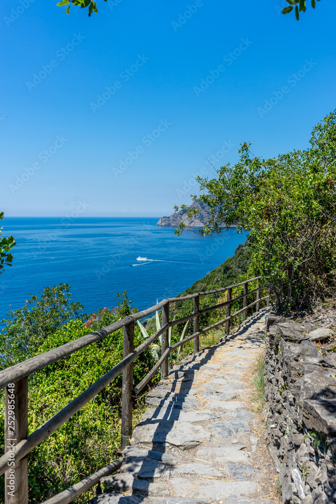 Fototapeta premium Italy, Cinque Terre, Corniglia, a bridge over a body of water