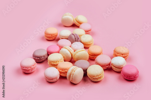 Macaroons in a pink background. Close ups. Space for text.