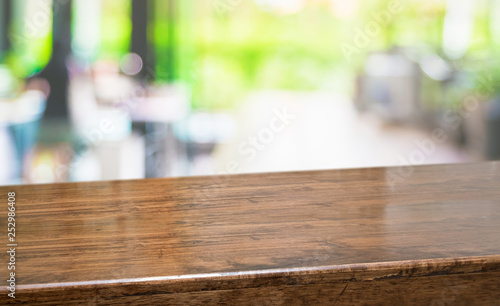 Empty perspective hardwood table with blur kitchen in garden background bokeh light,Mock up for display or montage of product,Banner or header for advertise on online media.