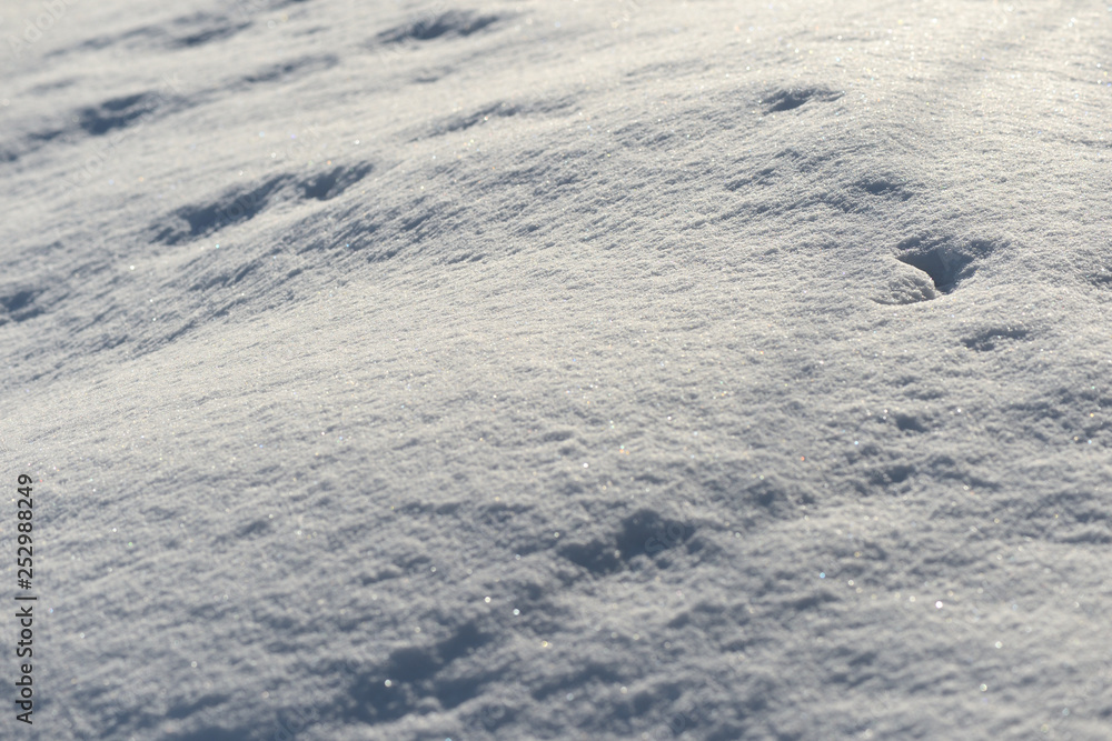 White snow texture on a sunny day. Winter background White snow texture on a sunny day. Winter background