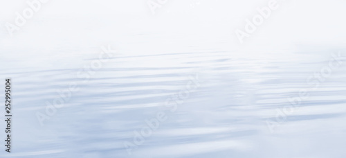 water surface with waves and ripples. tinted