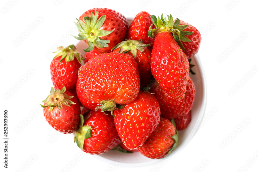 Strawberries in a white bowl isolated on white background, top view