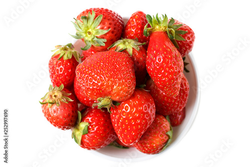 Strawberries in a white bowl isolated on white background, top view