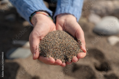 Female holding sand