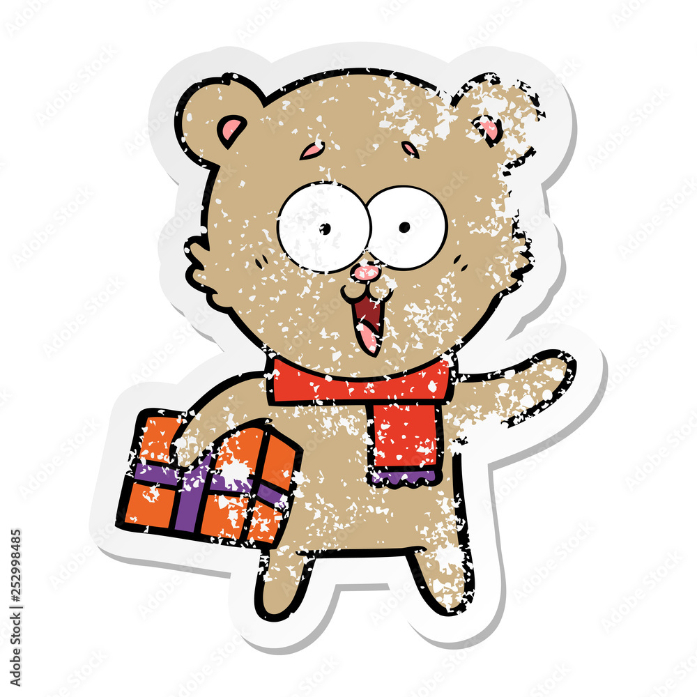 distressed sticker of a laughing teddy bear with christmas present distressed sticker of a laughing teddy bear with christmas present