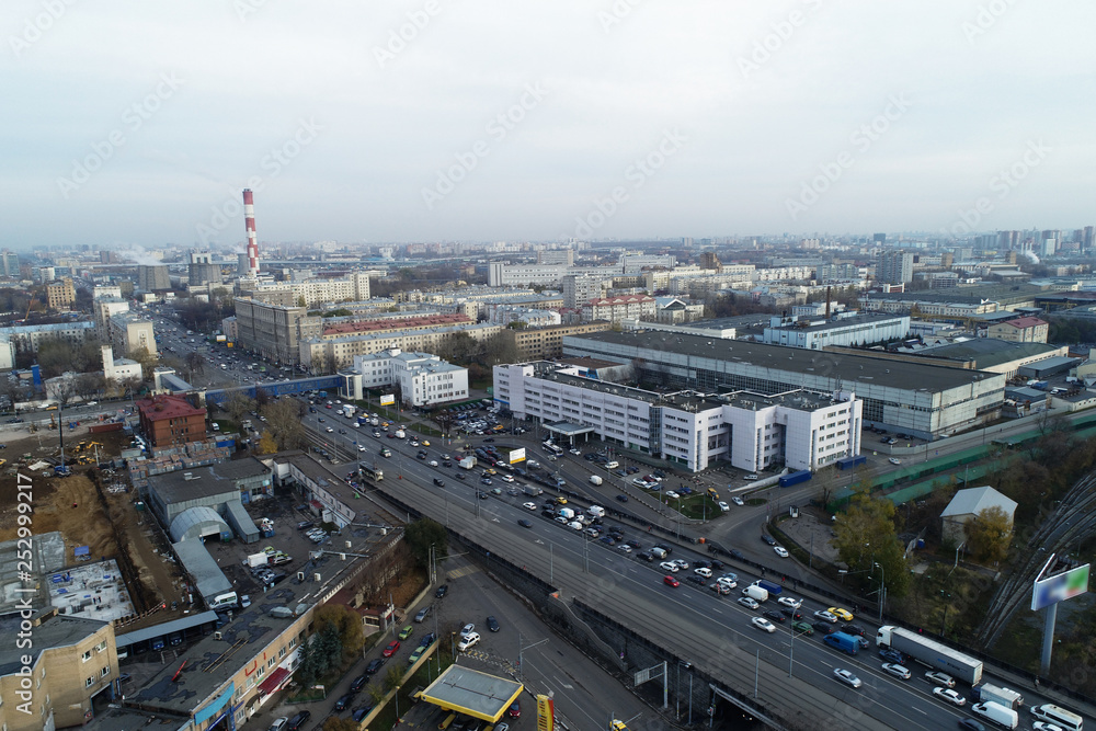 Aerial view of the city district. A wide road passes through the city Aerial view of the city district. A wide road passes through the city