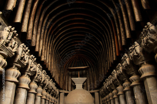 Rock cut stupa with only surviving wooden umbrella in western Indian rock-cut Karla caves, Pune district, Maharashtra India. photo