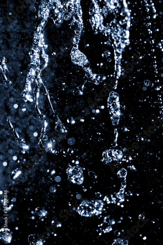 water jet with splashes on a black background