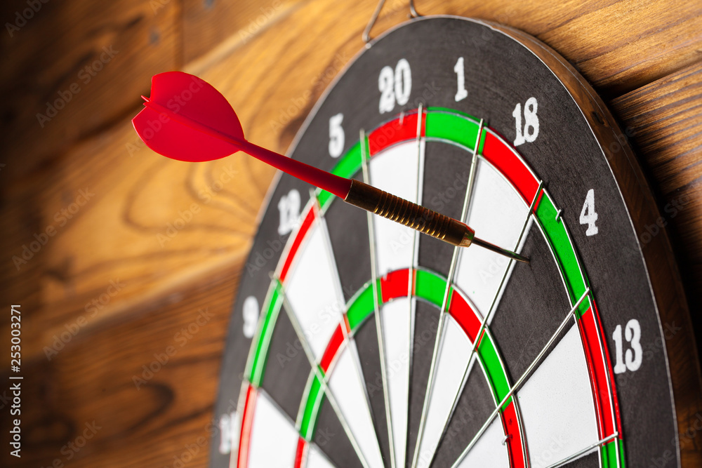 The darts on wooden background The darts on wooden background