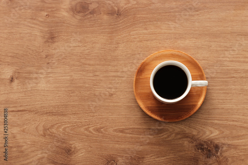coffee cup over wooden table . top view