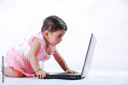 Indian baby girl with laptop