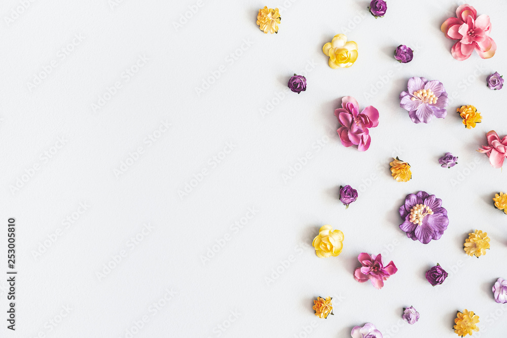 Flowers composition. Frame made of colorful flowers on pastel gray background. Flat lay, top view, copy space, square Flowers composition. Frame made of colorful flowers on pastel gray background. Flat lay, top view, copy space, square