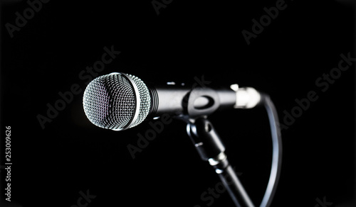 Microphone, mic, karaoke, concert, voice music. Closeup microphone. Vocal audio mic on a bleck background. Live music, audio equipment. Karaoke concert, sing sound. Singer in karaokes, microphones.