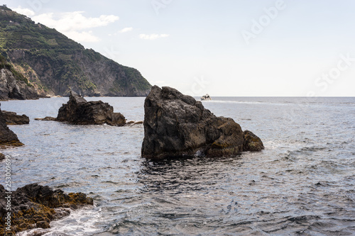 Italy, Cinque Terre, Manarola, a rocky island in the middle of a body of water