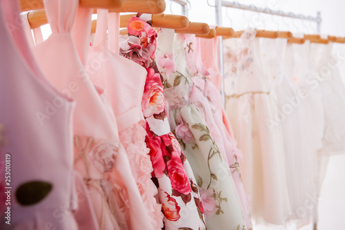Dresses hung on hangers © Sumire_Sumire