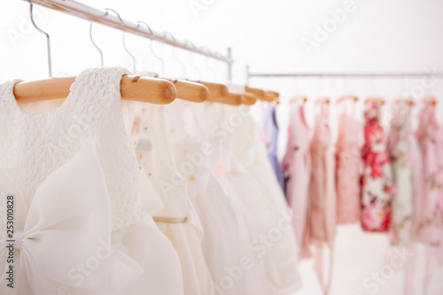 White dresses hung on hangers