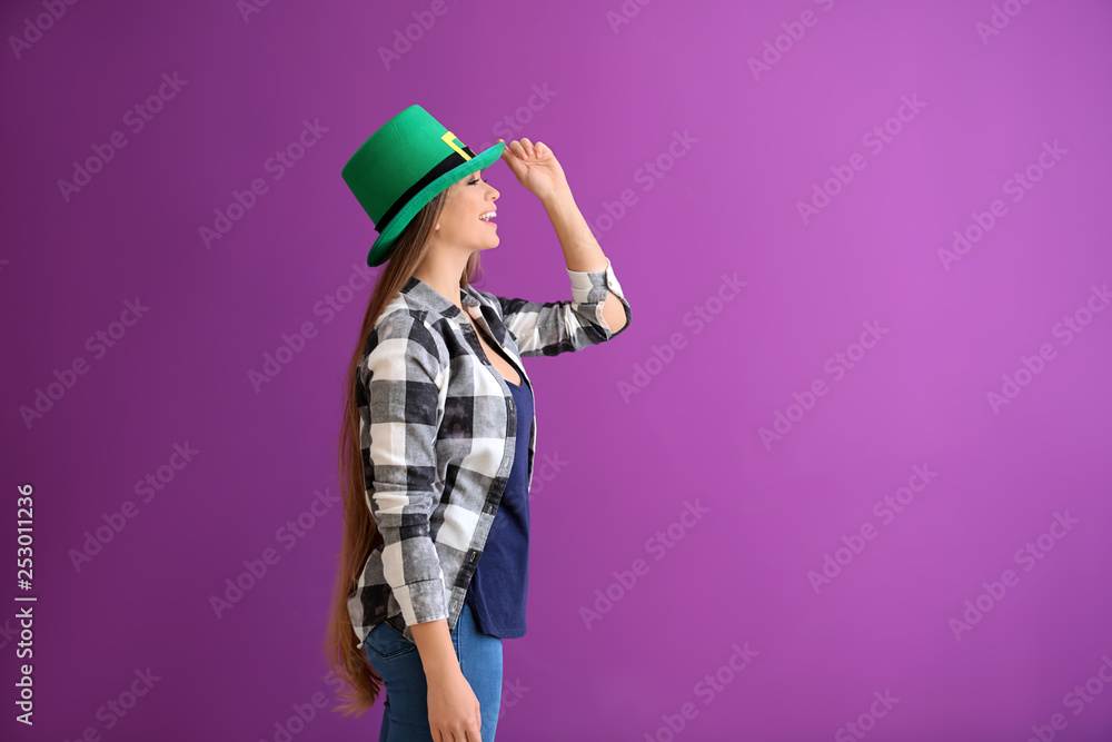 Beautiful young woman in green hat on color background. St. Patrick's Day celebration Beautiful young woman in green hat on color background. St. Patrick's Day celebration