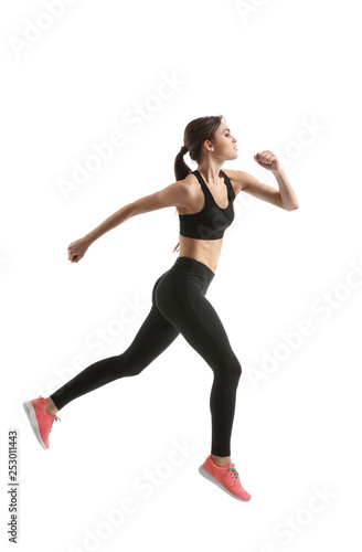 Sporty female runner on white background © Pixel-Shot