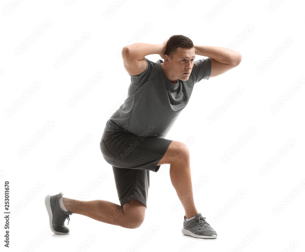 Sporty young man training against white background Sporty young man training against white background