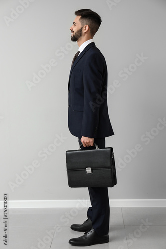Handsome businessman near l...