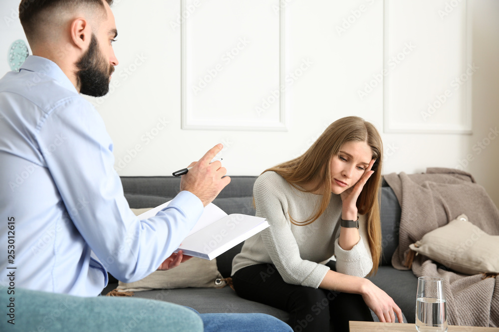Male psychologist working with patient in office Male psychologist working with patient in office