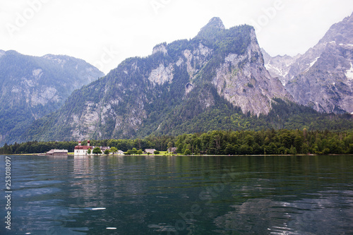Large stone mountains in the Alps on Konigssee Lake