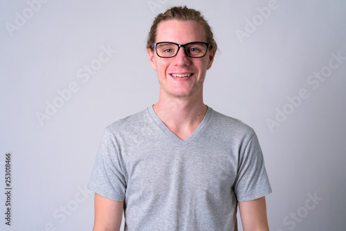 Face of happy young handsome man with eyeglasses smiling © Ranta Images