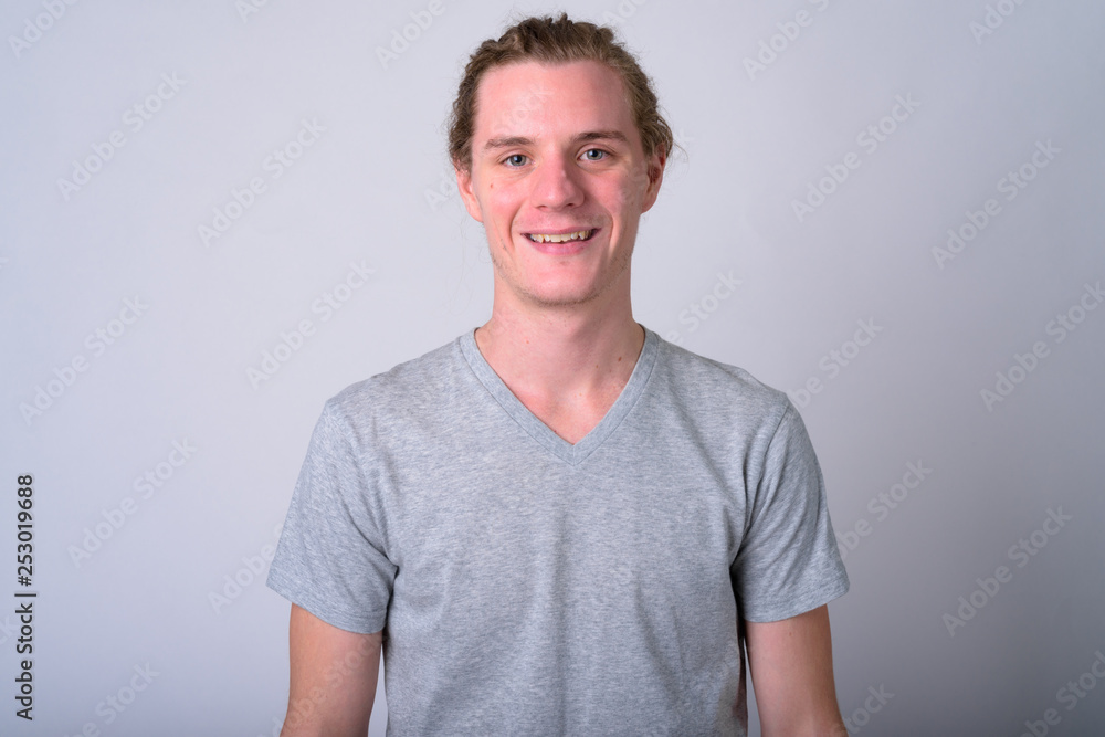 Fototapeta premium Portrait of happy young handsome man smiling