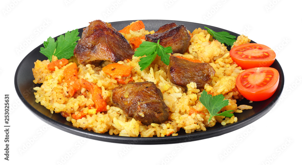 pilaf with meat on black plate isolated on white background