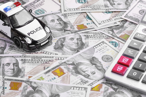 Car insurance policy. Document, model of car, calculator and coins. Business and insurance background concept.
