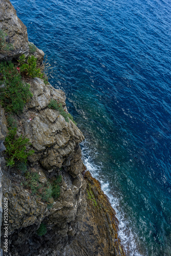 Italy, Cinque Terre, Manarola, water next to the rock © SkandaRamana