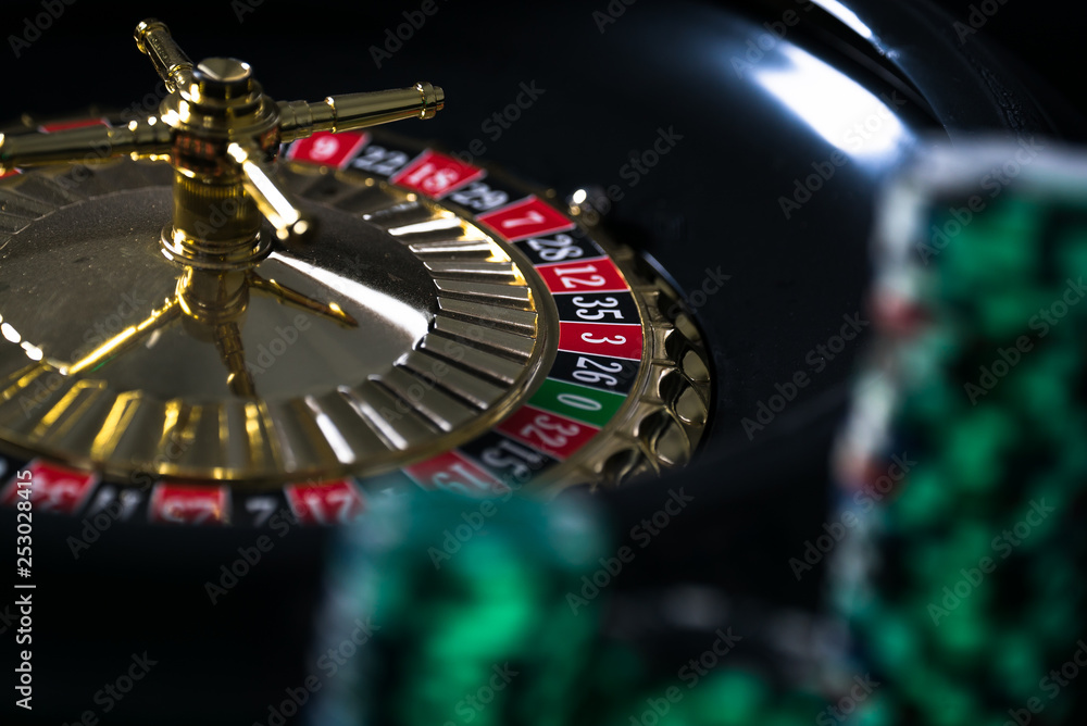 Casino background, poker Chips on gaming table, roulette wheel in motion, Casino background, poker Chips on gaming table, roulette wheel in motion,