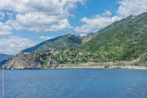 Italy, Cinque Terre, Manarola, a large body of water with a mountain in the background