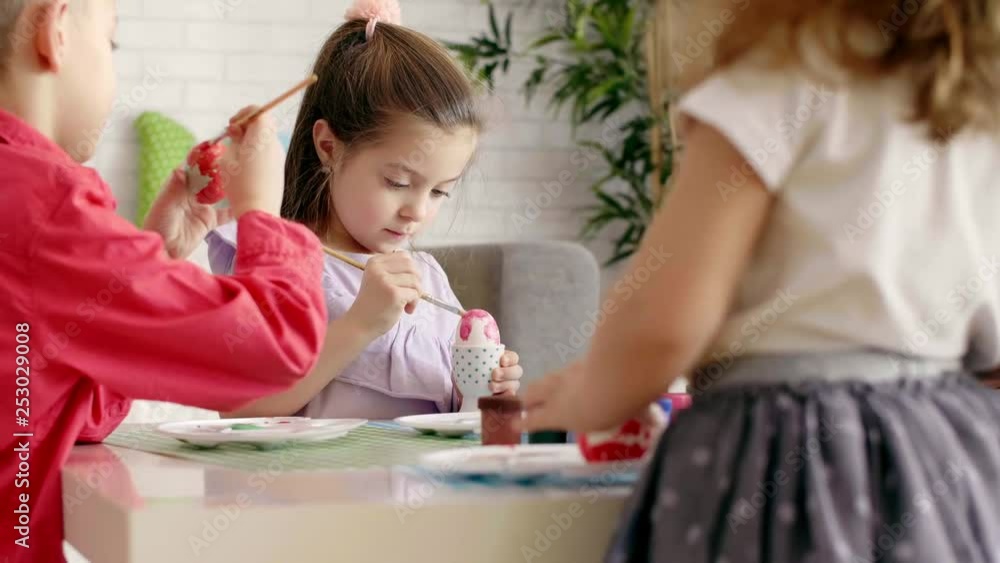 Group of children painting easter eggs Group of children painting easter eggs