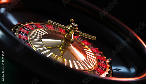 Photography Casino background,  poker Chips on gaming table, roulette wheel in motion,