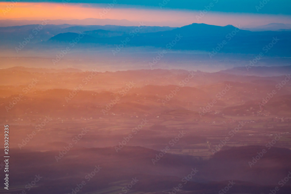 Sunset over hills in countryside