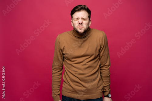 Nervous embarassed man, looks worried before visiting doctor or dentist. Anxious concerned male student feels anxiety before passing course or diploma paper, afraid of difficult questions.