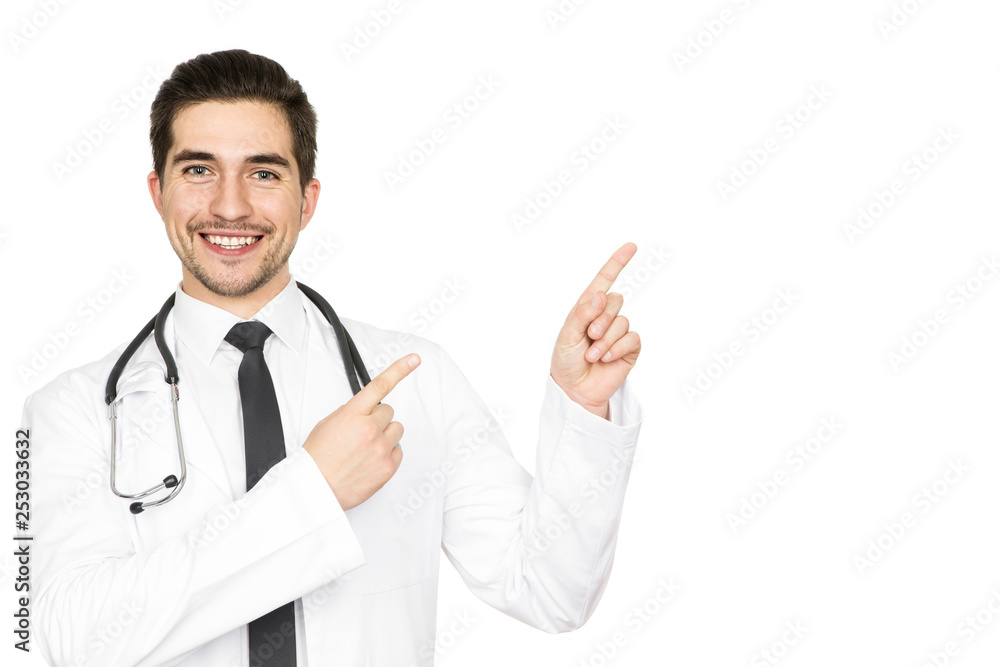 Your ad here. Handsome male doctor smiling happily pointing at the copyspace on the side isolated on white Your ad here. Handsome male doctor smiling happily pointing at the copyspace on the side isolated on white