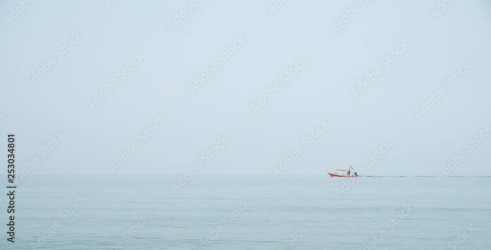 Wooden long tail boat in the sea