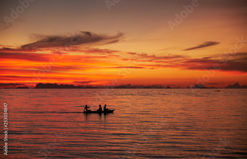 Silhouette of a boat with people. Thailand © spaxiax