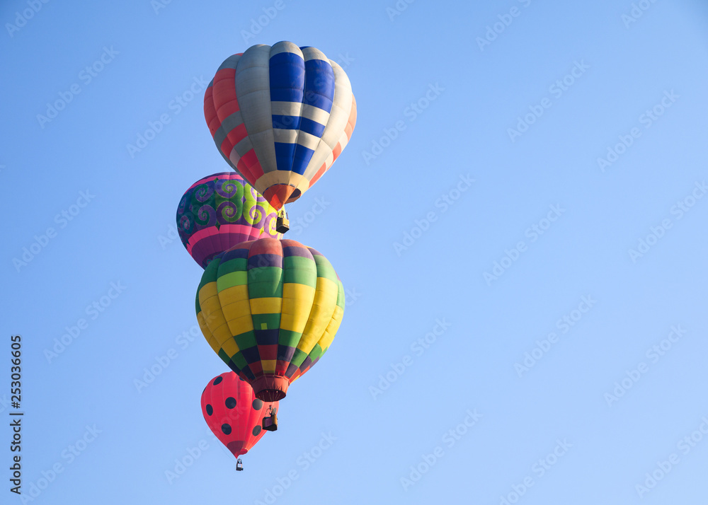 Fototapeta premium Hot air balloons flying on blue sky