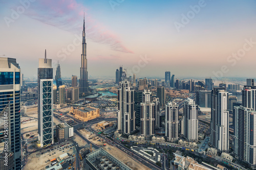 Skyline of a big modern city. Dubai, United Arab Emirates, at sunset. Aerial view.