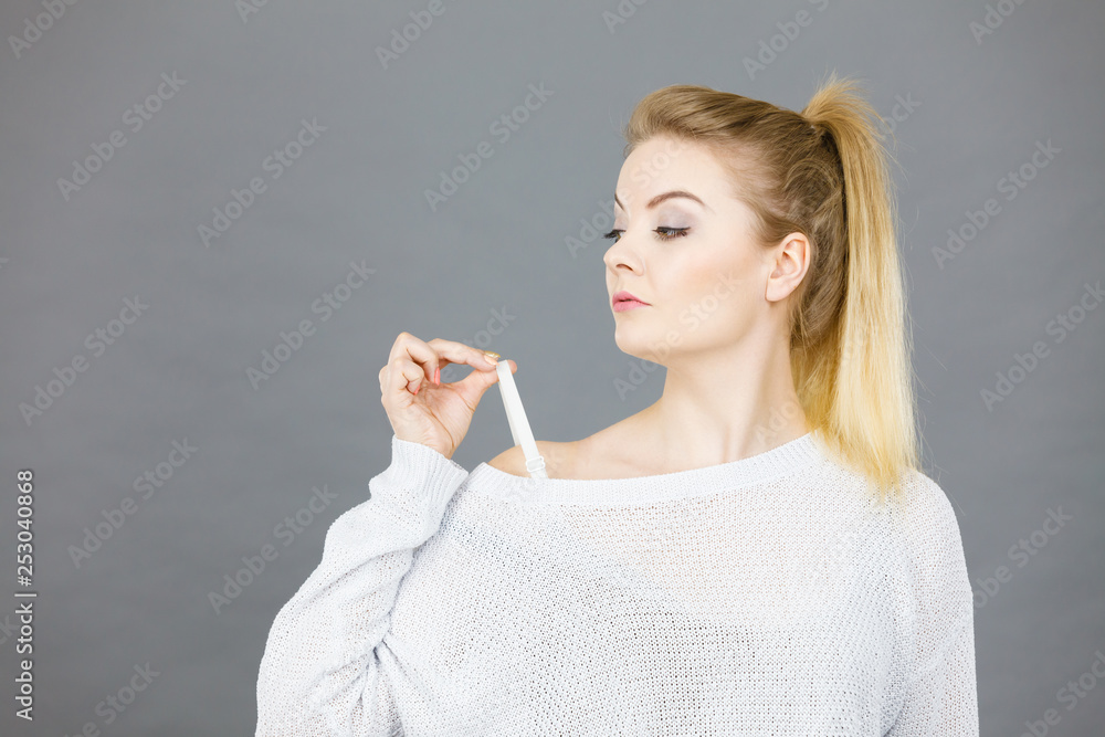 Woman holding her bra strap Woman holding her bra strap